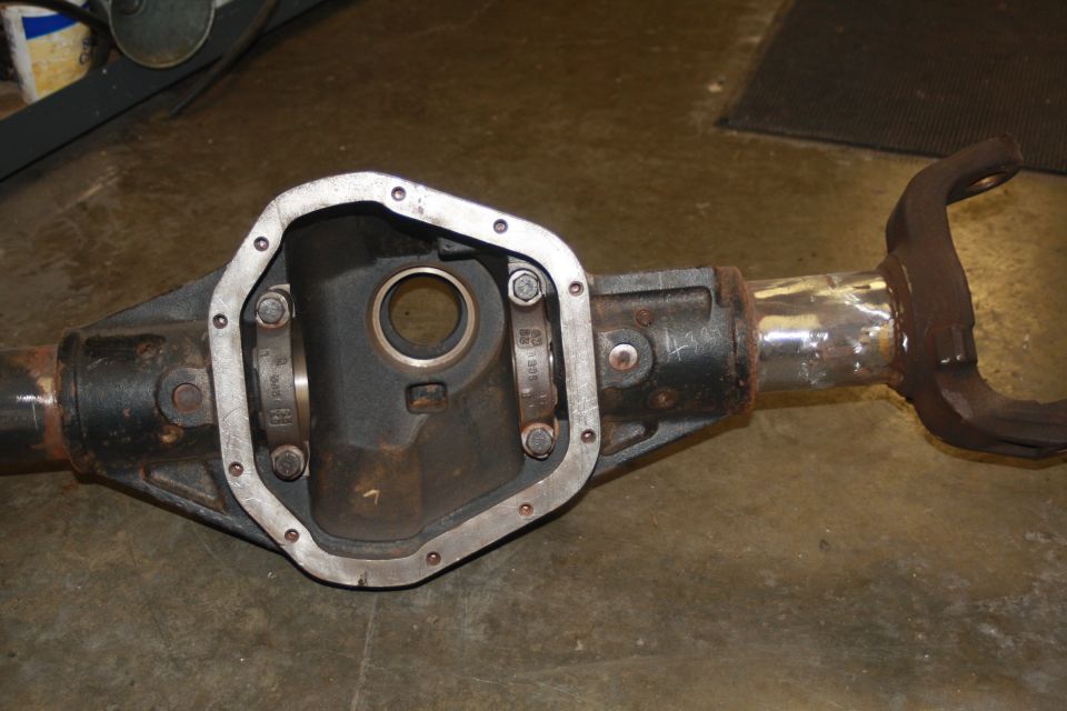 Differential axle housing with part numbers visible on internal components