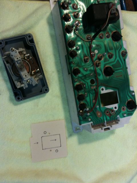 Suzuki Samurai - Close-up of disassembled dashboard instrument cluster components and a small diagram.