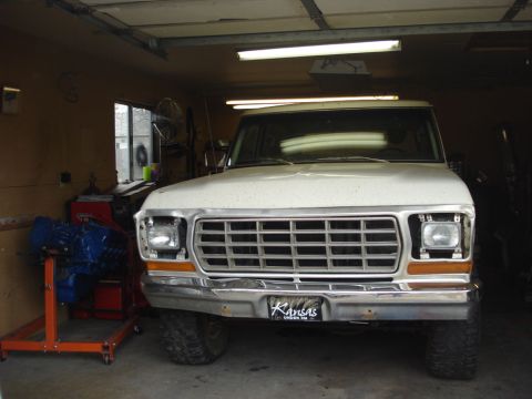 1979 Ford Bronco - Front view of a white 1979 Ford Bronco parked inside a garage with a Kansas license plate.
