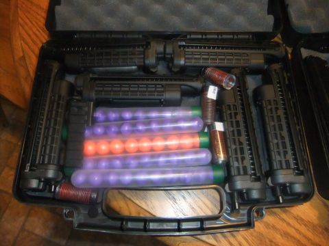 1978 Chevrolet C/K Pickup - A black case holds disassembled paintball gun components and several tubes filled with paintballs.