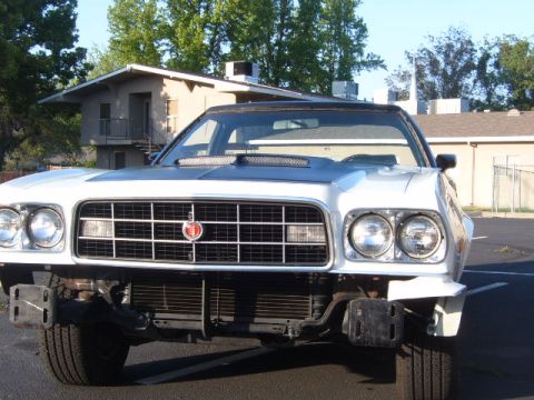 1973 Ford Ranchero - The front of a white 1972 Ford Ranchero shows a prominent grille and dual headlights.