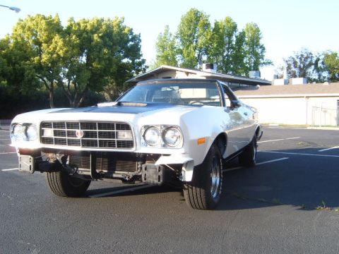 1973 Ford Ranchero - 1973 Ford Ranchero in white with a black hood, seen from the front 3/4 angle.