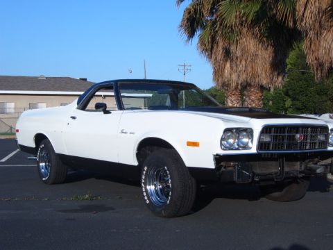 1973 Ford Ranchero - White 1973 Ford Ranchero parked outside with a palm tree in the background.