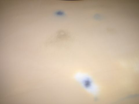 1980 Chevrolet Camaro - The image shows several dark spots on a light-colored surface, possibly paint imperfections, with a website logo at the bottom.