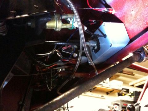 Suzuki Samurai - Complex wiring and a silver box are visible under the dashboard of a vehicle.