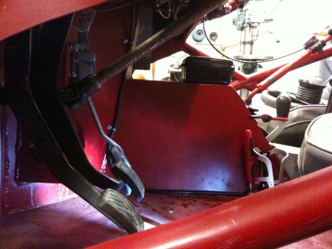 Suzuki Samurai - Close-up view of the interior footwell and pedals of a vehicle.