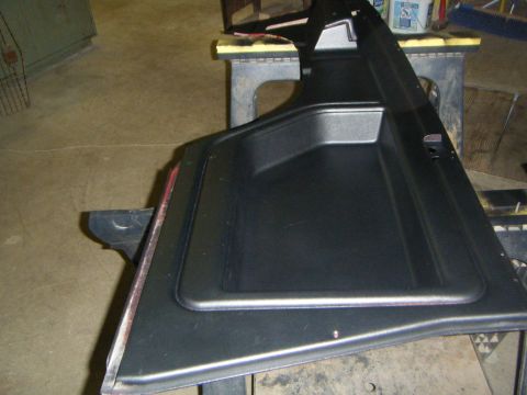 Black interior door panel with storage pocket