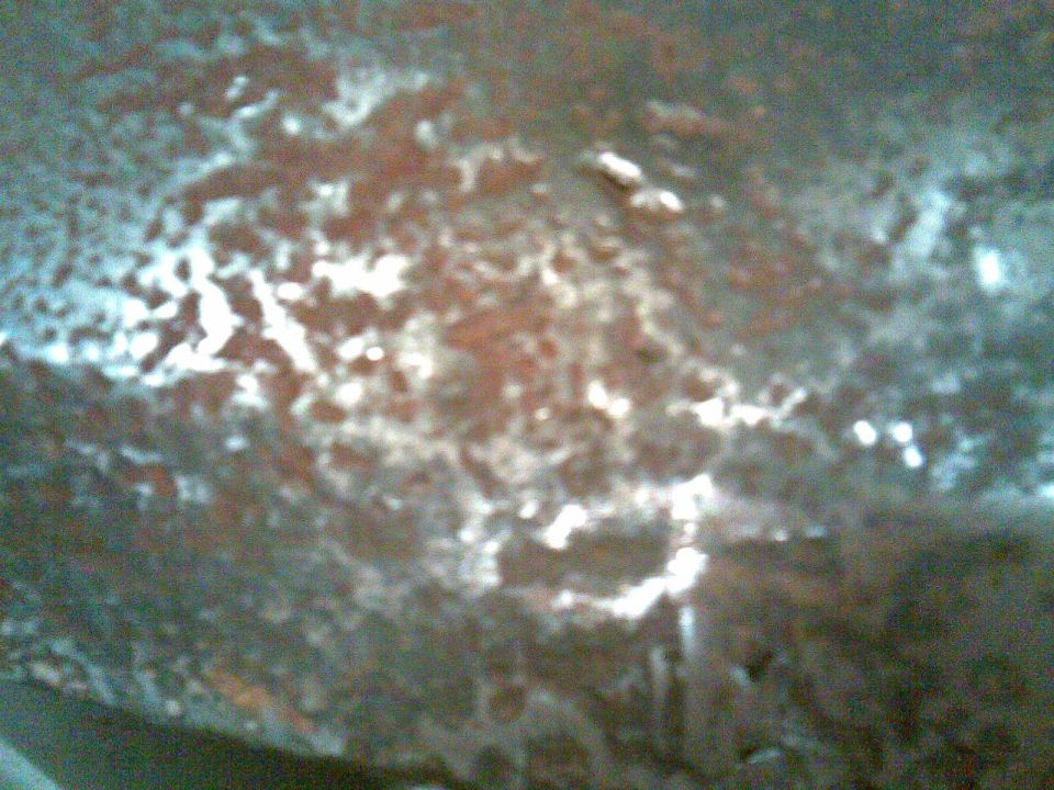 after grinding some, the pitted areas started crumbling through

lets not kid ourselves, there's only enough metal left to make a strainer
