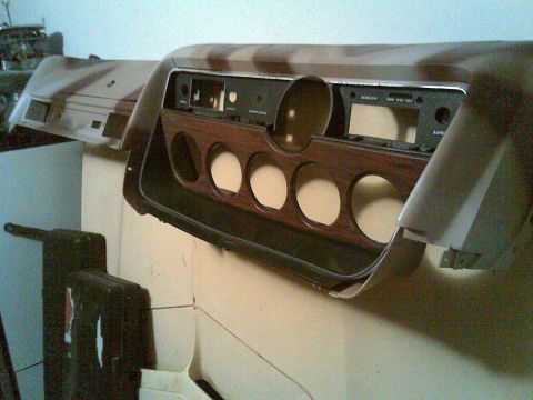 1972 Ford Ranchero - Dashboard assembly with wood grain trim and multiple gauge cutouts, likely for a classic vehicle.