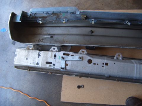 1973 Ford Ranchero - Disassembled car bumper assembly, showing inner reinforcement and outer cover.