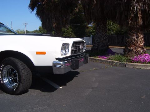 1973 Ford Ranchero - White 1977 Ford Ranchero front end detail with chrome grille and bumper.