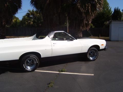 1973 Ford Ranchero - Side profile of a white 1973 Ford Ranchero pickup truck parked outdoors on a sunny day.
