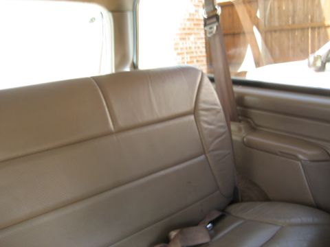 1993 Ford Bronco — Tan leather interior with seatbelt visible