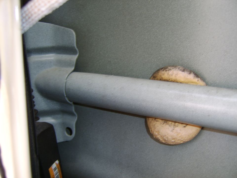 A close-up of the door beam pictured and labeled above. The small black part in the bottom left is the lock actuator.