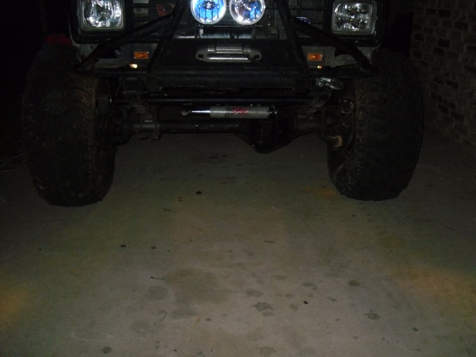 Front axle, large tires, and winch on an off-road vehicle