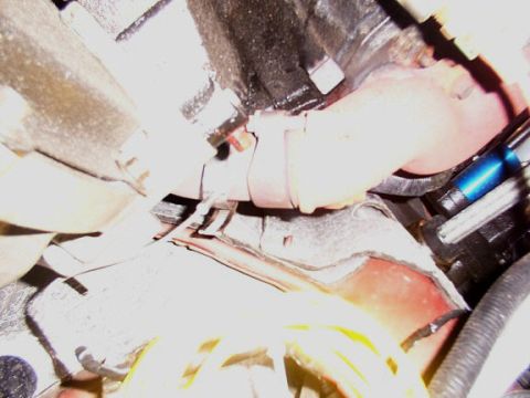 2001 Ford Excursion - Pyrometer installed in the pipe running between the exhaust manifold and the turbo. Be careful drilling. Run drill slow and use a magnetic…