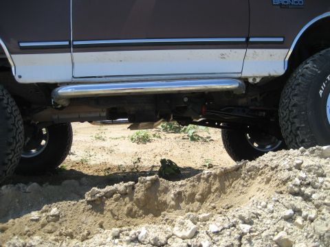 1993 Ford Bronco - This 1993 Ford Bronco features a lifted suspension, chrome side steps, and aggressive off-road tires.