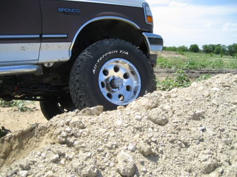 1993 Ford Bronco - This 1993 Ford Bronco features a two-tone paint scheme and is equipped with off-road tires and suspension.