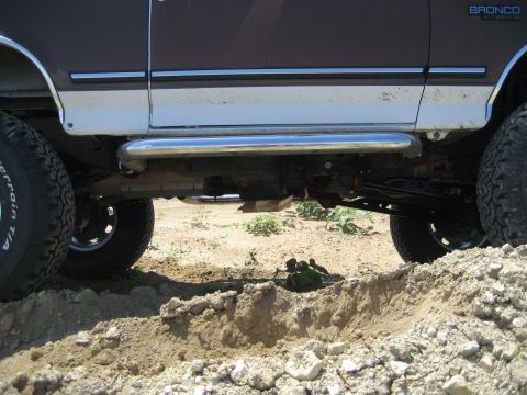 1993 Ford Bronco - The side profile of a 1993 Ford Bronco is shown with its running boards and large tires.