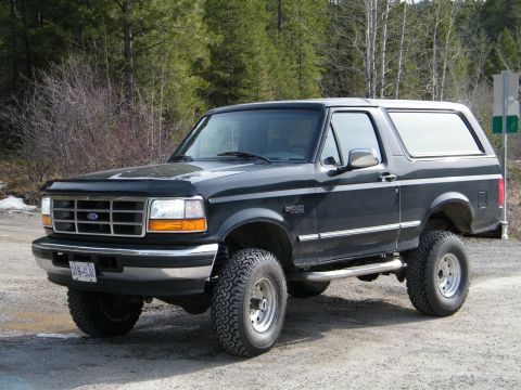 Black Ford Bronco with lifted suspension and off-road tires
