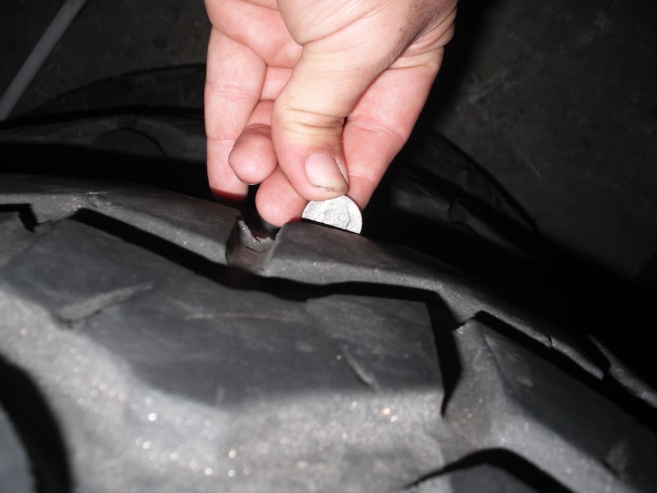 Tire tread depth measured with a dime
