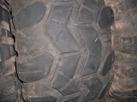 1991 Ford Bronco - A detailed view of a tire's tread pattern, showing its robust design.