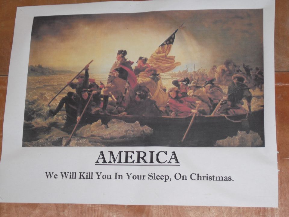 Painting of Washington Crossing the Delaware with "AMERICA We Will Kill You In Your Sleep, On Christmas."