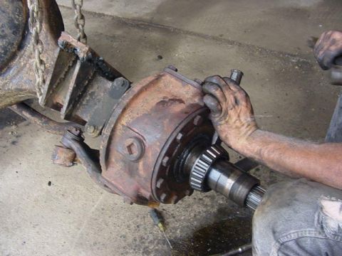 1992 Ford Bronco - knock bearings off. i used varying sized chisels between the flange and bearing. be caruefull not to hit spindle hit chisel!