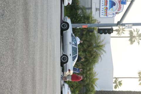 1992 Ford Taurus - A 1992 Ford Taurus sedan is seen parked curbside near a water park.