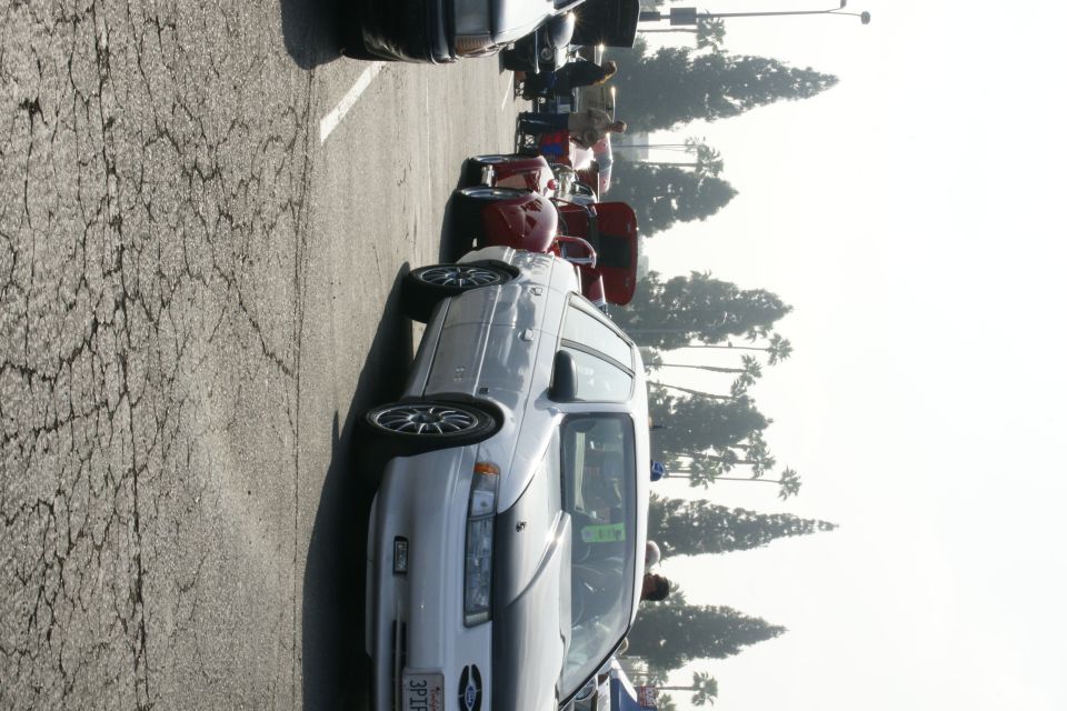 1992 Ford Taurus station wagon parked in a lot, front 3/4 view. License plate reads 3P TE