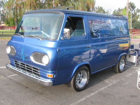 1996 Ford C-350 (Centurion Conversions) - Customized blue van with a "California Dreamin'" mural on the side, parked outdoors.