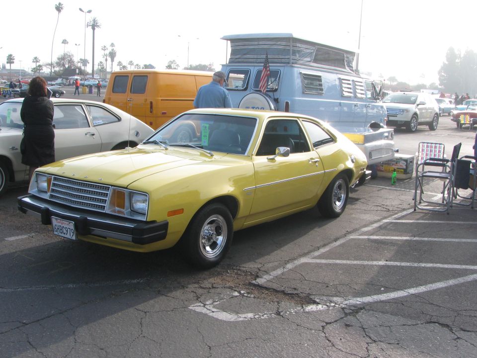 Yellow 1977 Ford Pinto coupe, 3/4 front view. License plate 6HBC919