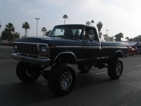 1996 Ford C-350 (Centurion Conversions) - This lifted pickup truck, likely a 1979 Ford F-Series, is shown in a 3/4 front view.