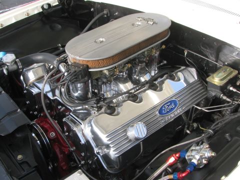1996 Ford C-350 (Centurion Conversions) - Engine bay detail showing a Ford V8 with chrome accents and performance fuel lines.