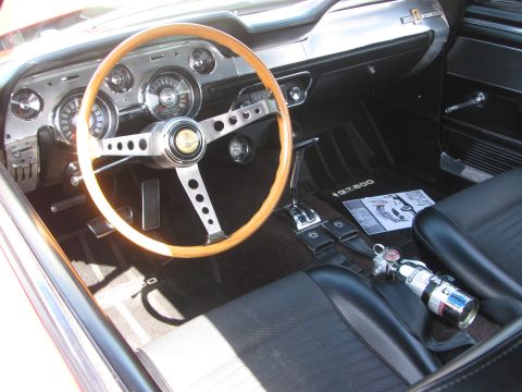 1996 Ford C-350 (Centurion Conversions) - Interior of a 1967 Shelby GT500, a wood-rimmed steering wheel and racing seats.