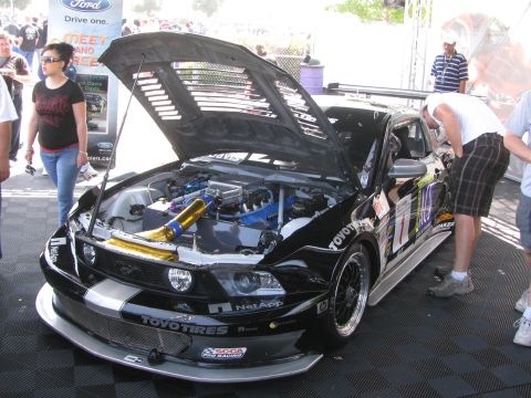 1996 Ford C-350 (Centurion Conversions) - Customized Ford Mustang race car on display with engine exposed.