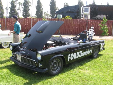 1996 Ford C-350 (Centurion Conversions) - A black Ford Thunderbird with racing modifications is displayed with its hood open.