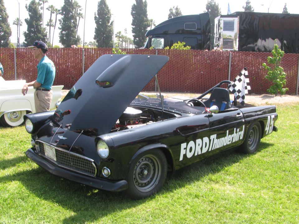 Black Ford Thunderbird race car with hood open, checkered flag on back. Number 45 on rear fender