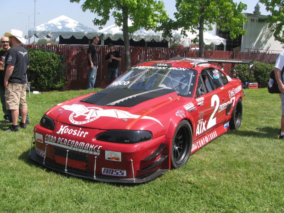 Red race car with Hoosier and Ford Performance decals, number 2 on door