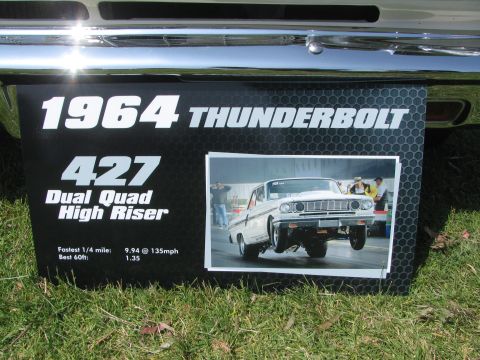 1996 Ford C-350 (Centurion Conversions) - Sign displays a 1964 Thunderbolt with 427 engine details and a photo of the car on the drag strip.