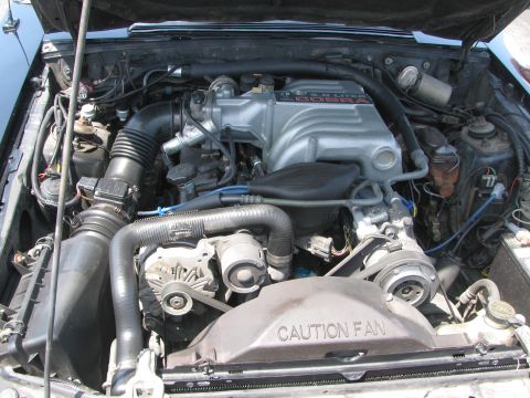 1996 Ford C-350 (Centurion Conversions) - Engine bay details, including the intake manifold and fan shroud, suggest a 1993 model year.