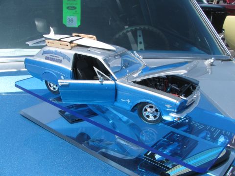 1996 Ford C-350 (Centurion Conversions) - A detailed model car, possibly a custom van, is displayed with its doors and hood open.