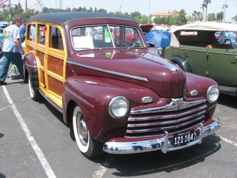 1996 Ford C-350 (Centurion Conversions) - This maroon woody wagon features prominent wood paneling and a classic grille design.