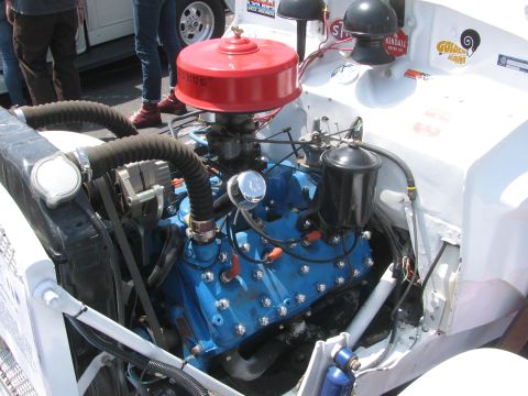 1996 Ford C-350 (Centurion Conversions) - Close-up of a vintage V8 engine, likely from the 1940s, with a prominent red air cleaner.