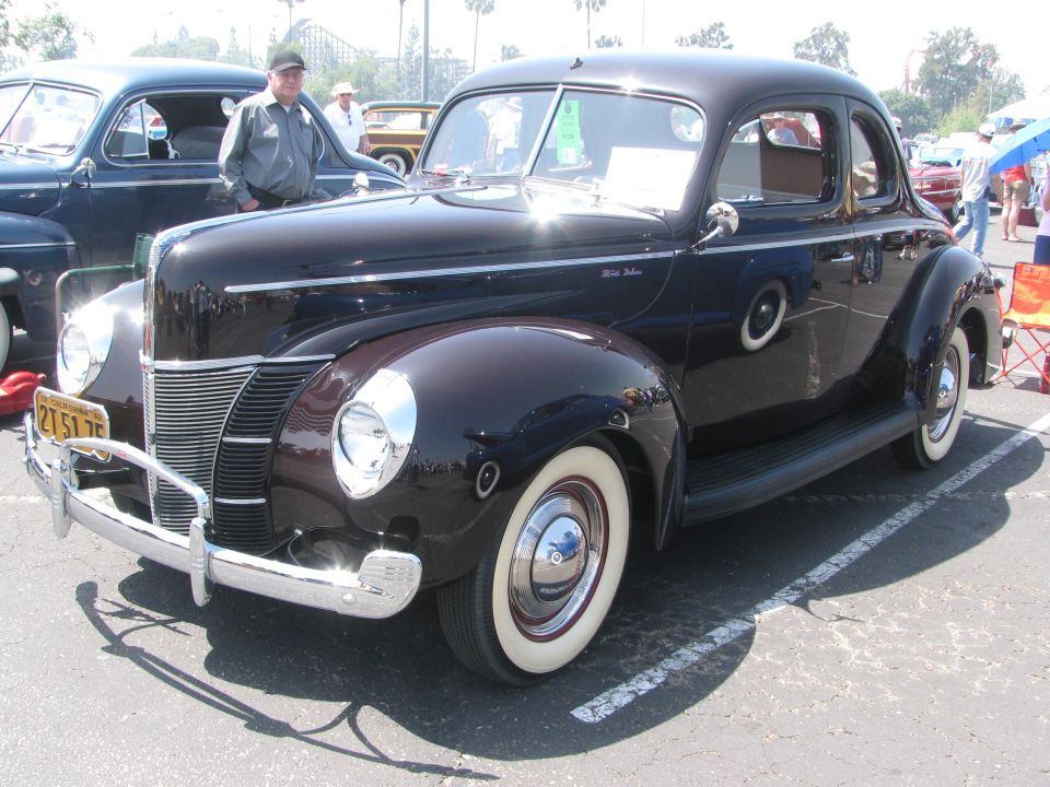 1939 Ford Coupe parked next to another classic car