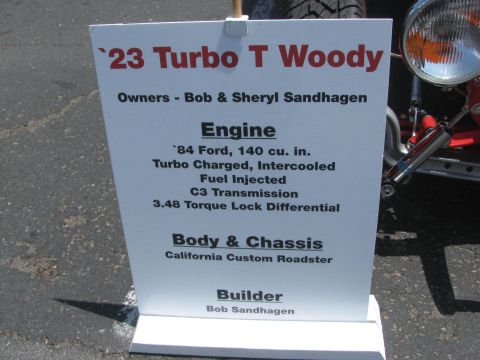 1996 Ford C-350 (Centurion Conversions) - A sign details the specifications of a custom roadster, including its engine and body type.