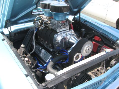 1996 Ford C-350 (Centurion Conversions) - Close-up of a heavily modified engine bay, a prominent supercharger and twin air intakes.