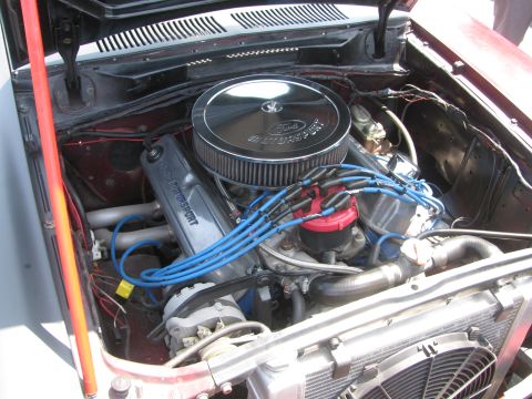 1996 Ford C-350 (Centurion Conversions) - Close-up view of a Ford Motorsport engine, a chrome air cleaner and prominent blue spark plug wires.