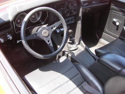 1996 Ford C-350 (Centurion Conversions) - The interior of a vehicle is captured, highlighting the dashboard, steering wheel, and seating areas.