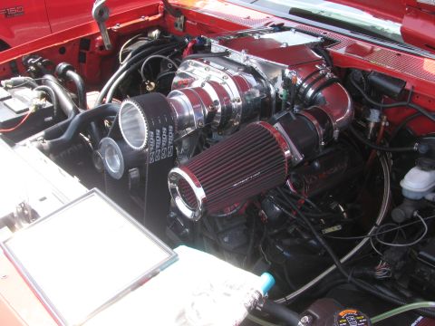 1996 Ford C-350 (Centurion Conversions) - Engine bay detail a prominent supercharger and intake system.